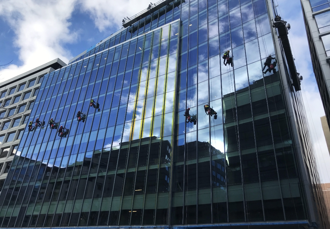 facade of 1441 L Street with contractors working on the windows