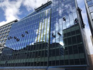 1441 L Street NW windows being worked on by construction workers