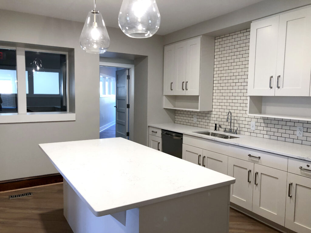 remodeled kitchen with new countertops and lighting