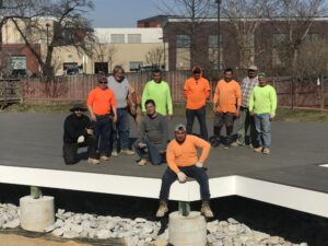 Ternion Builders contractors posing at greenhouse construction site